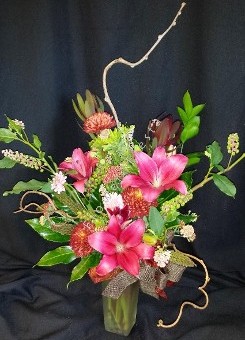 Autumn mix with lilies and kiwi branches