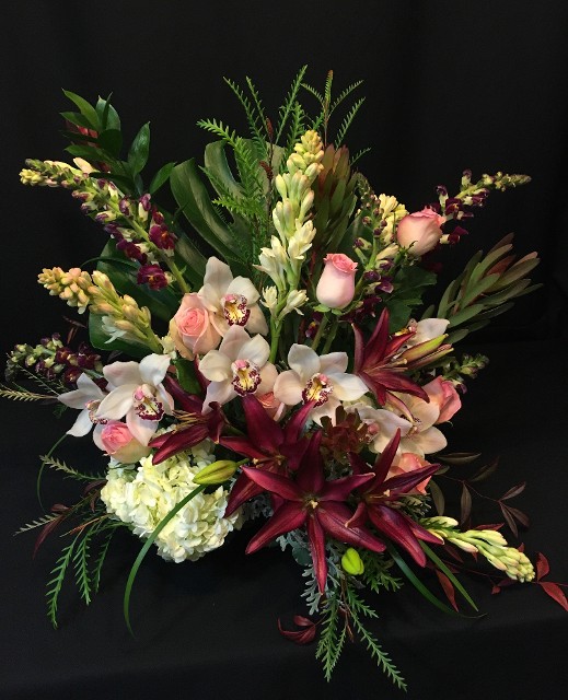 Tropical display of Roses Lilies and Cymbidium for valentine delivery