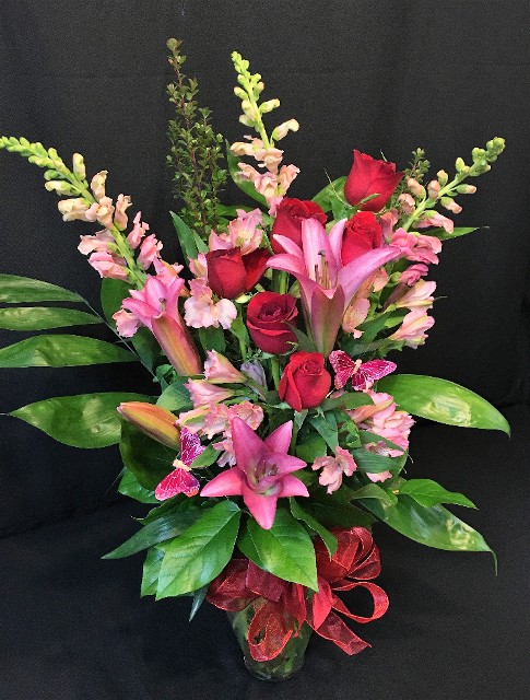oriental fragrant lilies with red roses and butterflies