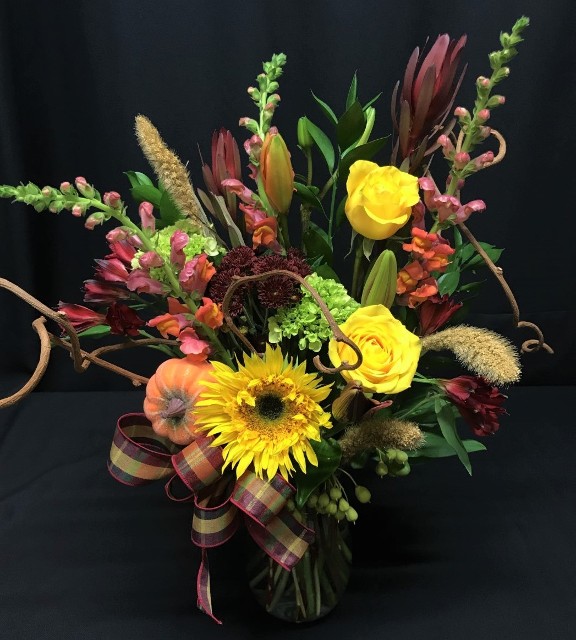 Fall mixed flower basket with sunflowers and branches