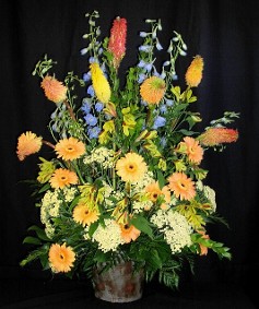 spring basket of flowers for funeral or memorial