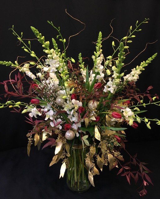 Christmas event flowers with orchids gold branches and tulips