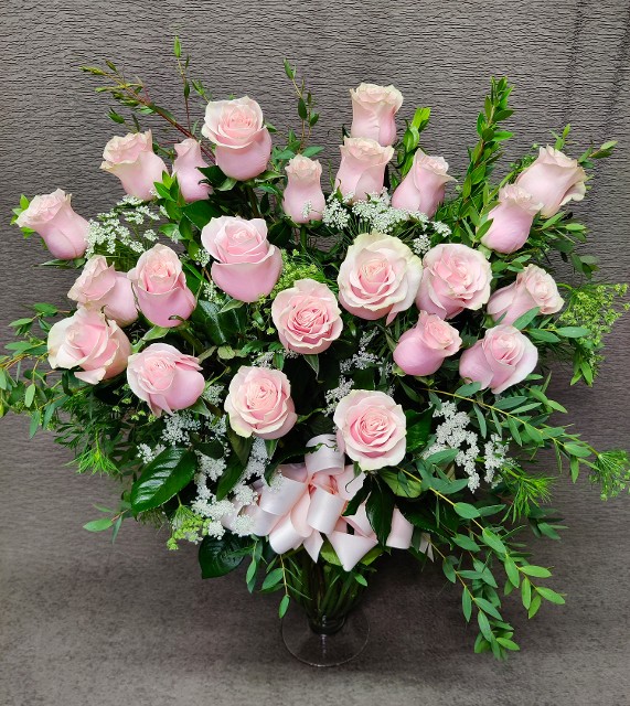 2 dozen colored roses light pink must be ordered 3 weeks prior to Valentine's day or color may be substituted