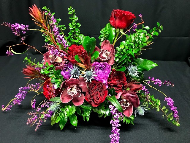 romantic jewel tone valentine bouquet with blossoming vines